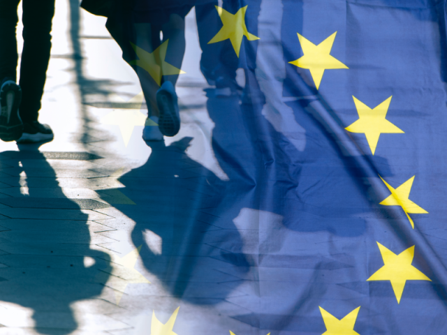 EU-Flag-with-2-people-